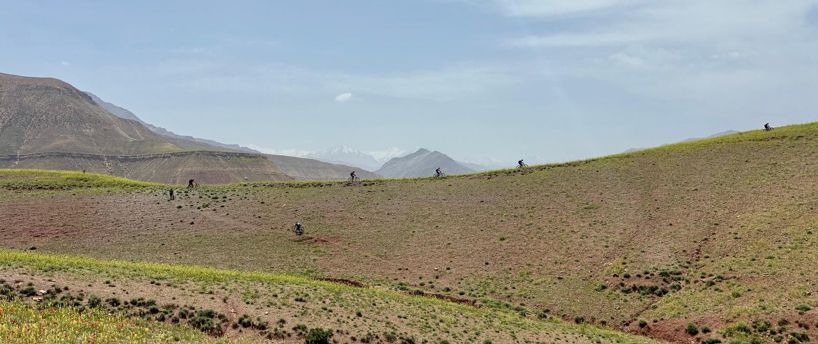 Mountain bikers riding a ridge in the Moroccan Atlas