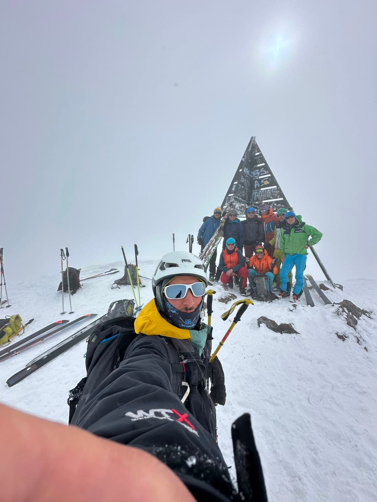 Ski tourers on a summit in the Moroccan Atlas