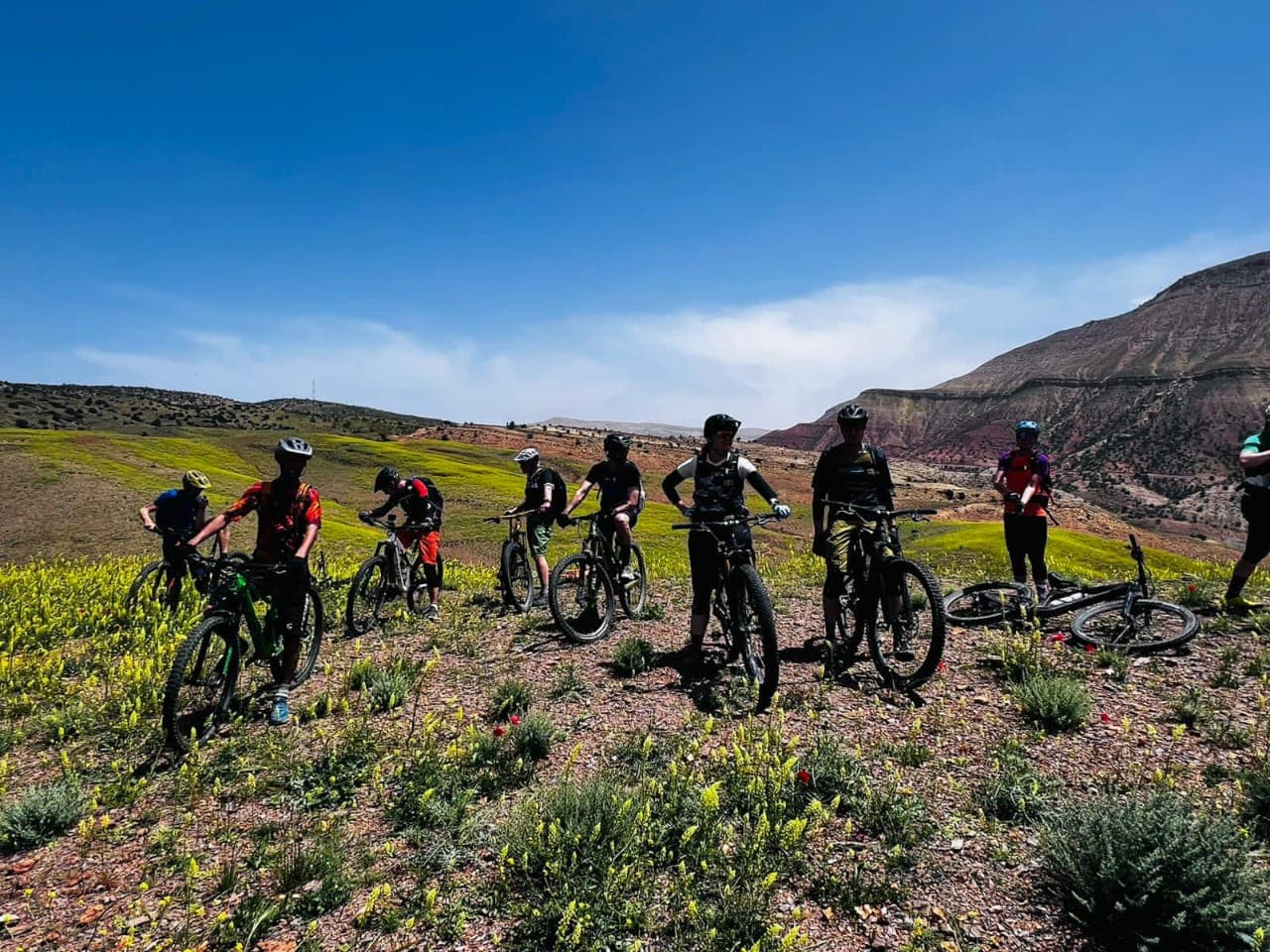 Mountain bikers crossing the Atlas landscape